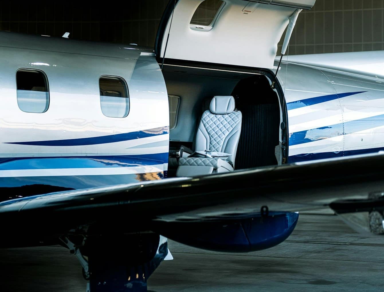 A Pilatus PC-12 turboprop with its cabin door open