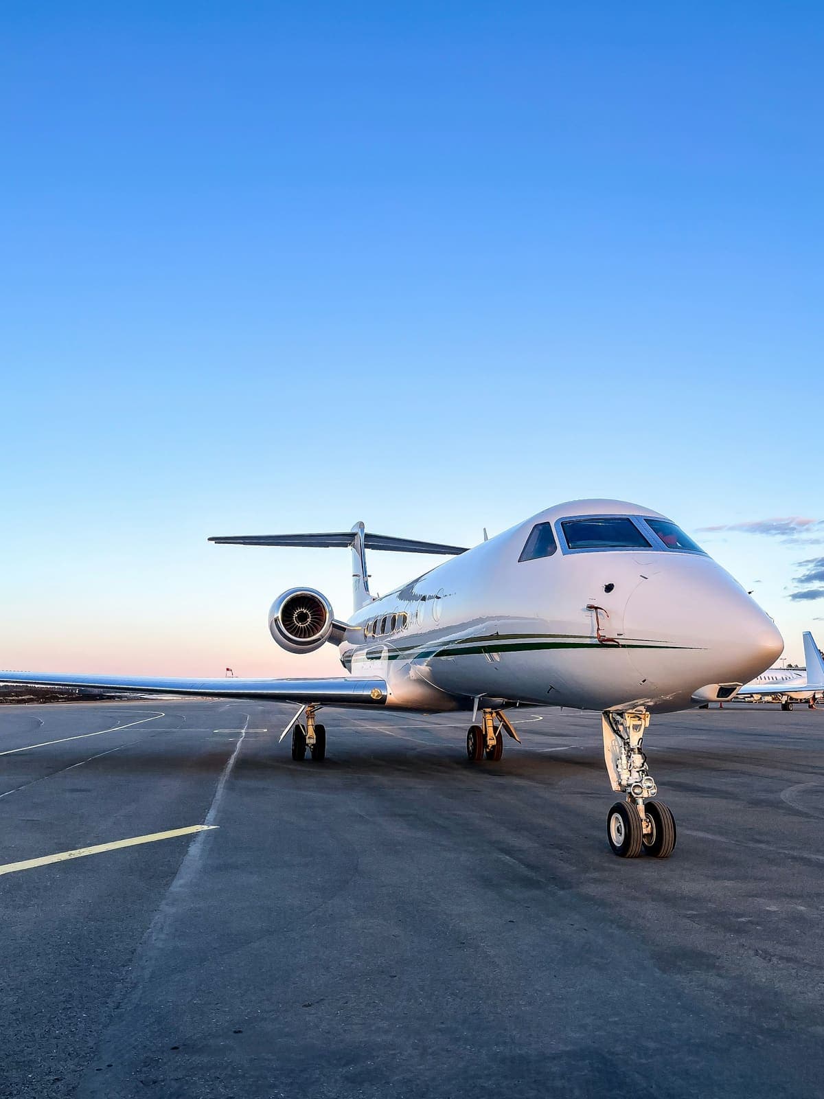 A Gulfstream on an empty tarmac at blue hour